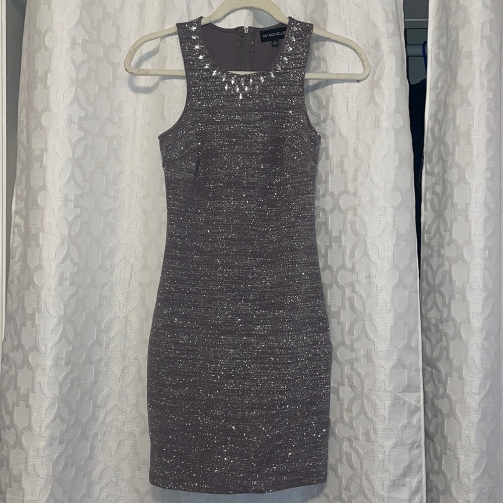 Silver sparkly mini dress with gems on the neckline. Size 1
